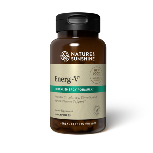 Natural Energy Supplement bottle with ginseng, yerba mate, and ginkgo leaves, symbolizing herbal vitality and fatigue support.